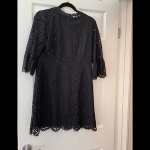 Lace dress, black mid thigh length.